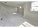 Spacious room with window providing natural light, carpet, and neutral colors, ideal for a versatile space at 6369 Kelsey Dr, Indianapolis, IN 46268
