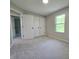 Bedroom with three closets, a window, and neutral carpet at 6369 Kelsey Dr, Indianapolis, IN 46268