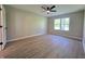 Spacious bedroom with ceiling fan and window at 6369 Kelsey Dr, Indianapolis, IN 46268