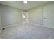 Neutral bedroom with light gray walls, carpet, and white doors, offering a calm and inviting space at 6369 Kelsey Dr, Indianapolis, IN 46268