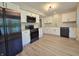 Bright kitchen features white cabinets, granite countertops, and stainless steel appliances at 6369 Kelsey Dr, Indianapolis, IN 46268