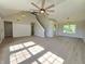 Bright and spacious living room featuring vaulted ceilings, staircase, and modern flooring at 6369 Kelsey Dr, Indianapolis, IN 46268