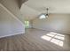 Bright and spacious living room featuring vaulted ceilings, large window, and modern flooring at 6369 Kelsey Dr, Indianapolis, IN 46268