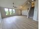 Bright living room featuring large windows, vaulted ceilings, staircase and modern flooring at 6369 Kelsey Dr, Indianapolis, IN 46268