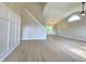 Bright and spacious living room featuring vaulted ceilings, large window, and modern flooring at 6369 Kelsey Dr, Indianapolis, IN 46268