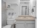 Functional bathroom features a toilet, vanity with sink, framed mirror and decorative shelves and towels at 6707 Greendale Ln, Indianapolis, IN 46241