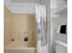 Bathroom featuring a tub-shower, a toilet, and white walls, with a decorative shower curtain at 6707 Greendale Ln, Indianapolis, IN 46241