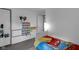 bedroom features a bed, wall decorations and a view into an adjoining space at 6707 Greendale Ln, Indianapolis, IN 46241