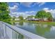 Tranquil view of the pond, enhancing the property's peaceful appeal at 6707 Greendale Ln, Indianapolis, IN 46241