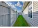 Side yard with a well-maintained fence and a view of the house's siding at 6707 Greendale Ln, Indianapolis, IN 46241