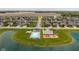 Aerial view of community pool, playground, and lake in neighborhood at 695 Bobtail Dr, Greenfield, IN 46140