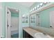 Bathroom with single sink vanity, large framed mirror, and combination shower and tub at 695 Bobtail Dr, Greenfield, IN 46140