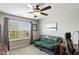 Bright bedroom featuring a large window, comfortable seating, and modern decor at 695 Bobtail Dr, Greenfield, IN 46140