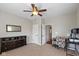 Comfortable bedroom featuring neutral walls, plush carpeting and ample closet space at 695 Bobtail Dr, Greenfield, IN 46140