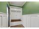 Charming entryway with built-in storage cabinets, coat hooks, and a cozy bench at 695 Bobtail Dr, Greenfield, IN 46140