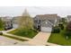Beautiful two-story home with a well-manicured lawn and attached two-car garage at 695 Bobtail Dr, Greenfield, IN 46140