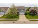 Stunning two-story home with a well-maintained front yard and ample parking space at 695 Bobtail Dr, Greenfield, IN 46140