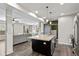 Modern kitchen featuring an island with a sink, stainless steel appliances, and an open concept design at 695 Bobtail Dr, Greenfield, IN 46140