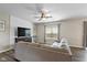 Bright living room featuring a decorative shiplap wall, large window, and comfortable sofa at 695 Bobtail Dr, Greenfield, IN 46140