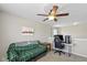 Cozy loft area with desk, chair, and ceiling fan is the perfect place for working at home at 695 Bobtail Dr, Greenfield, IN 46140