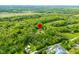 Aerial view showcasing the property's location amidst lush greenery and natural surroundings at 6968 S 300 W, Trafalgar, IN 46181