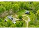 Stunning aerial view of a charming log cabin nestled on a beautiful lot surrounded by lush greenery and mature trees at 6968 S 300 W, Trafalgar, IN 46181