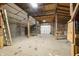 Bright barn interior featuring a garage door, open space, and convenient ladder access at 6968 S 300 W, Trafalgar, IN 46181