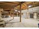 Spacious barn interior with shelves and vintage oven offers potential for various uses at 6968 S 300 W, Trafalgar, IN 46181
