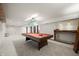 Finished basement with pool table, bar area, carpet flooring, and ample space for activities at 6968 S 300 W, Trafalgar, IN 46181