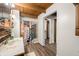 Bathroom with a wooden vanity, a patterned shower curtain, and an open doorway to another room at 6968 S 300 W, Trafalgar, IN 46181
