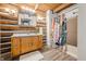 Charming bathroom features rustic log walls, a wooden vanity, and a colorful shower curtain at 6968 S 300 W, Trafalgar, IN 46181