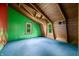 Bedroom features wood-beam ceiling, vibrant green wall with natural light streaming in from the windows at 6968 S 300 W, Trafalgar, IN 46181
