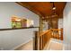 Upstairs hallway with a wooden railing and a view into the other rooms at 6968 S 300 W, Trafalgar, IN 46181