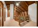 Hallway featuring wood ceilings, a railing, and natural lighting at 6968 S 300 W, Trafalgar, IN 46181