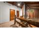 Hallway with wood details, log railing, and white walls offering a warm and inviting space at 6968 S 300 W, Trafalgar, IN 46181