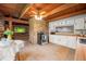 Spacious kitchen with white cabinets, stainless steel appliances, and a stone accent wall at 6968 S 300 W, Trafalgar, IN 46181