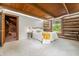 Comfortable main bedroom showcasing log walls and a wood beam ceiling at 6968 S 300 W, Trafalgar, IN 46181