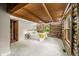 Cozy main bedroom featuring a wood beam ceiling, log walls and carpet at 6968 S 300 W, Trafalgar, IN 46181