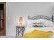 Close up of the cozy main bedroom with a patterned pillow and side table at 6968 S 300 W, Trafalgar, IN 46181
