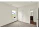 This bedroom features carpet, a window and a door leading to a bathroom at 7132 Sterling Way, Brownsburg, IN 46112