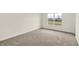 Inviting bedroom with plush carpeting and a large window, ideal for a relaxing space at 7132 Sterling Way, Brownsburg, IN 46112