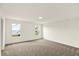 Bedroom featuring soft carpet, two windows, and neutral walls at 7132 Sterling Way, Brownsburg, IN 46112