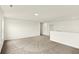 Open-concept bonus room featuring neutral carpet, walls, and recessed lighting at 7132 Sterling Way, Brownsburg, IN 46112
