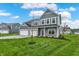 Attractive two-story home with three-car garage, green lawn, and well-maintained landscaping at 7132 Sterling Way, Brownsburg, IN 46112