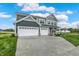 Charming two-story home with a three-car garage and concrete driveway on a sunny day at 7132 Sterling Way, Brownsburg, IN 46112