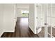 Inviting foyer with hardwood floors, neutral paint, and a view into the living area at 7132 Sterling Way, Brownsburg, IN 46112