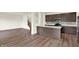Modern kitchen with stainless steel appliances, quartz countertops and dark wood cabinets at 7132 Sterling Way, Brownsburg, IN 46112