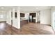 Modern kitchen with stainless steel appliances, a large island, and dark wood cabinetry at 7132 Sterling Way, Brownsburg, IN 46112