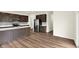 Well-equipped kitchen features stainless steel appliances, white countertops, and dark wood cabinets at 7132 Sterling Way, Brownsburg, IN 46112