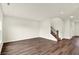 Spacious living room with wood floors and staircase, bathed in natural light at 7132 Sterling Way, Brownsburg, IN 46112